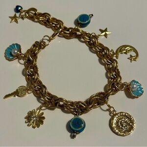 Gold Tone Charm Bracelet with 10 Charms